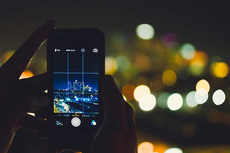 Phone-Taking-Photo-Of-City-At-Night